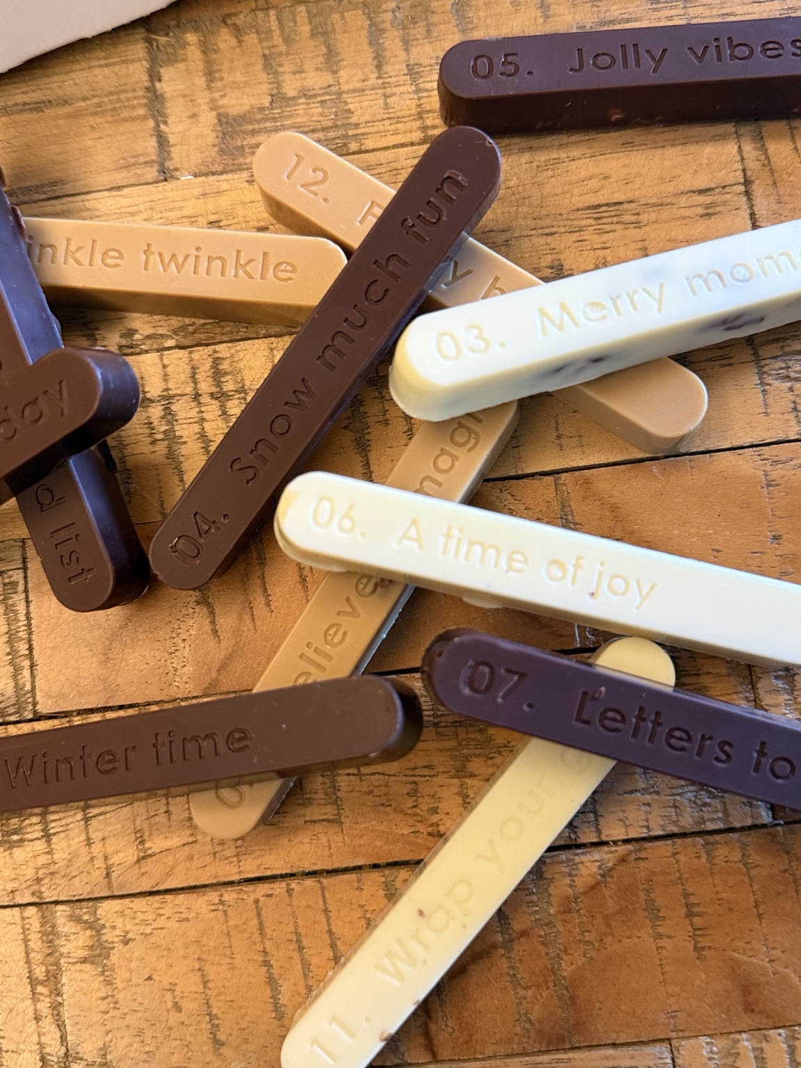 Close-up of dark, dulce and white chocolate fingers